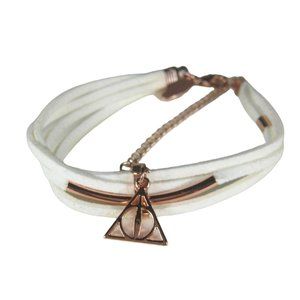 WBEI Warner Bros. White Leather Strap Bracelet  7.5 In Copper Triangle Charm